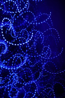 Dark blue background texture for text and design. Bokeh lights in the dark. light effect