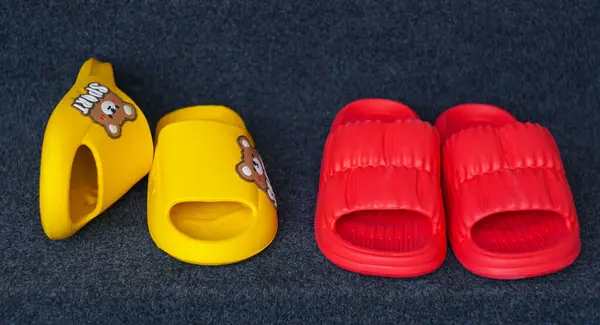 All kinds of rubber shoes stand on the carpet
