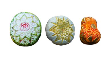 A picture of flowers is carved on the skin of a watermelon and a pumpkin on a white background clipart