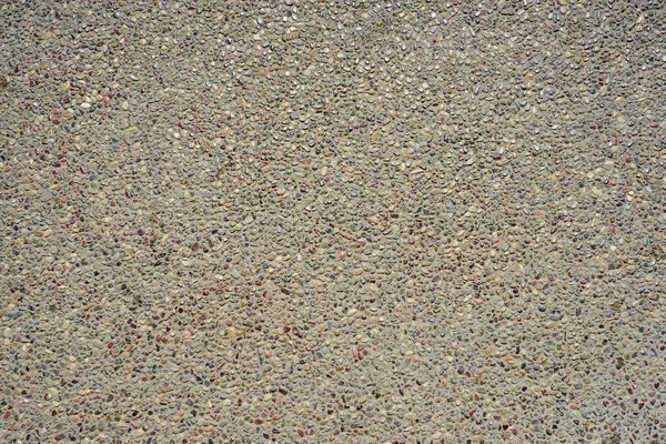 Der Straßenbelag Wird Als Hintergrund Mit Kleinen Kieselsteinen Ausgekleidet — Stockfoto