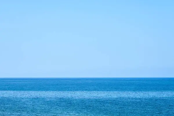 The horizon line in the fog on the Mediterranean Sea as a background