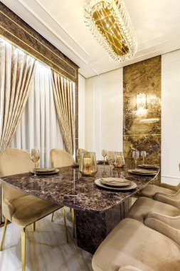 Marble dining table with utensil in a rich house