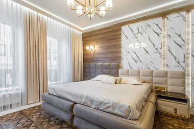 Luxury bedroom interior with parquet and marble walls