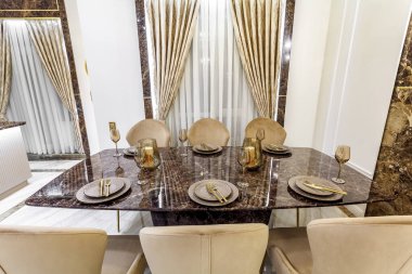 Marble dining table with utensil in a rich house