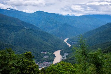 Aerial view of River Tista and Melli township, The Teesta River originates in the Himalayas and flows through West Bengal and Sikkim. clipart