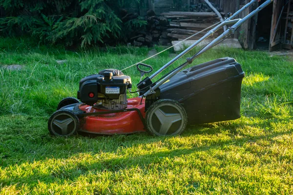 stock image Lawn mover on green grass. Machine for cutting lawns.