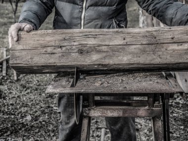 Carpenter's Hands Cutting Wood With Tablesaw clipart