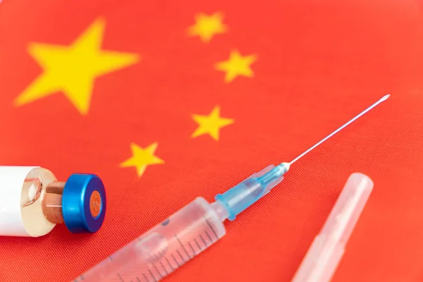 China Vaccination, Coronavirus China flag, Vaccine vial dose, needle syringe, concept vaccination