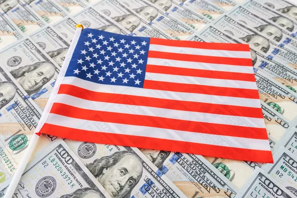 Dollar banknote and United States flag background. Economy of USA American flag and dollar cash money.