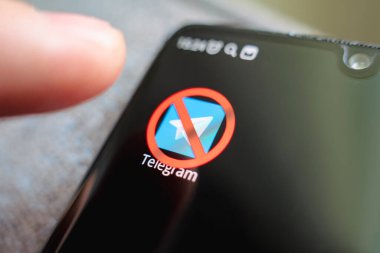 A crossed-out icon on a black smartphone screen. the concept of banning the application telegram. April 1, 2022. Barnaul. Russia