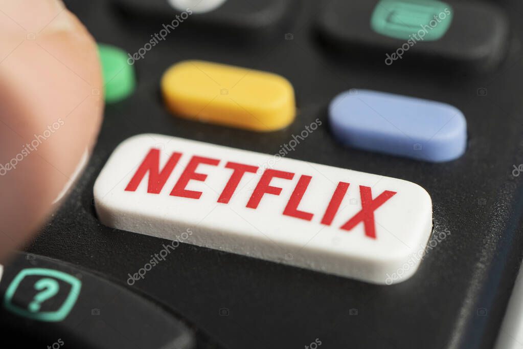 Barnaul russia, May 15, 2022: using a television remote with a dedicated Netflix logo on the button. TV remote control with Netflix logo.