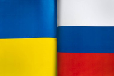 Ukrayna ve Rusya 'nın bayraklarının arka planı. İki ülke arasındaki etkileşim veya karşı etki kavramı. Uluslararası ilişkiler. politik görüşmeler. Spor yarışması.