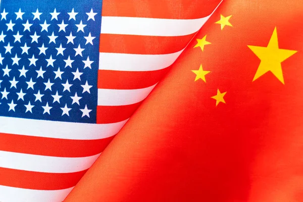 Background of the flags of the USA and china. The concept of interaction or counteraction between the two countries. International relations. political negotiations. Sports competition.