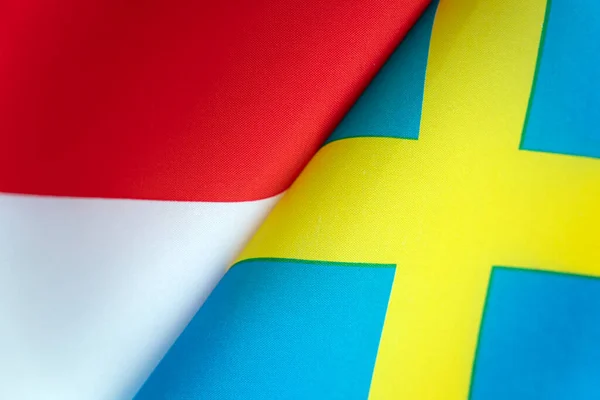 スウェーデンとインドネシアの国旗 国家間の国際関係の概念 政府の状態 人々の友情 — ストック写真
