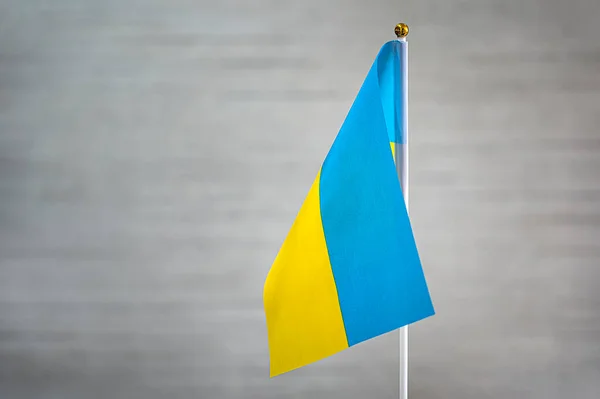 stock image Ukraine's flag is on a white background. flag symbols of Ukraine. close up of a Ukrainian flag waving in the wind.