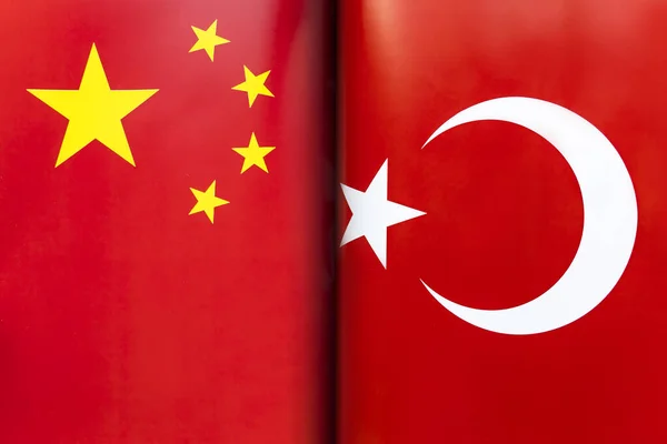 Flags turkey and china. The concept of international relations between countries. The state of governments. Friendship of peoples.