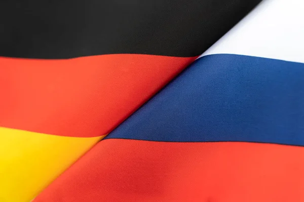 stock image Flags of the germany and Russia. The concept of international relations between countries. Sanctions against Russia. The state of governments. Friendship of peoples.