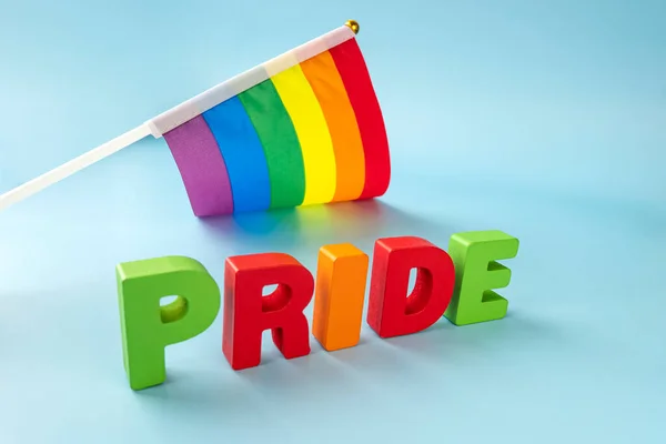 Word PRIDE in single letters on blue background