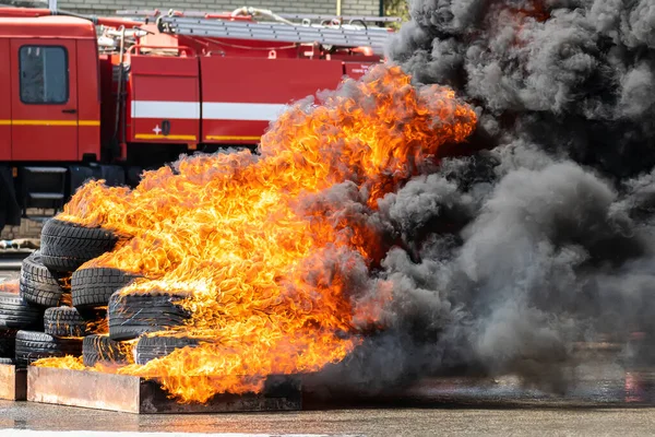 Strong Flames Burning Car Tires Background Fire Truck Firefighters Training — Stock Photo, Image