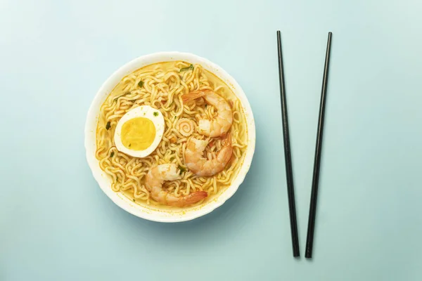 Spicy Prawn Noodle or Hokkien Mee - a combination of egg noodle, vermicelli, shrimp, shredded chicken, egg and water spinach covered with prawn and pork broth.