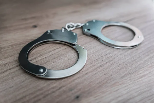 Handcuffs Wooden Table Concept Arrest Crime — Stock Photo, Image