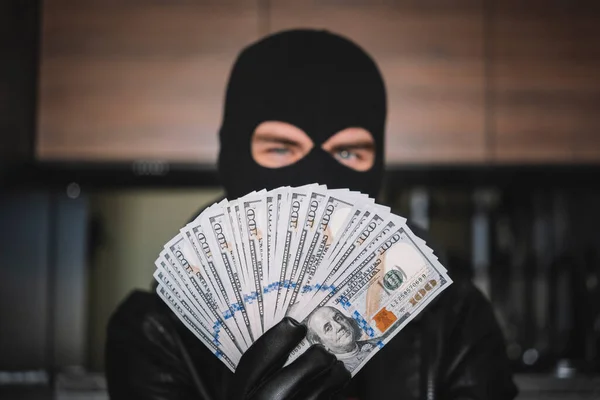 Greed Concept Grumpy Disguised Criminal Holding Bunch Stollen Dollars Isolated — Stock Photo, Image