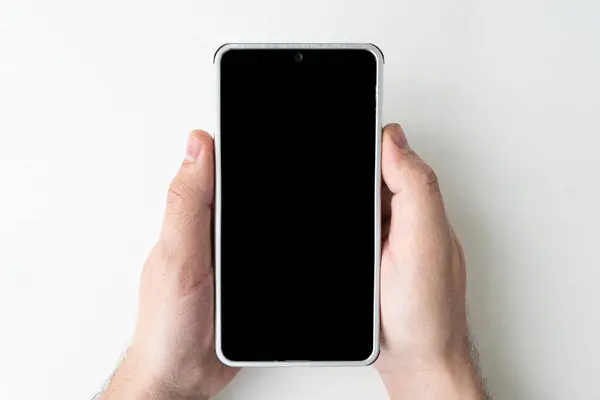 Attrappe Einer Männlichen Hand Die Ein Schwarzes Rahmenloses Handy Mit — Stockfoto
