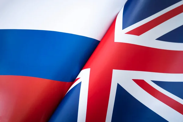 stock image Flags Great Britain and russia. The concept of international relations between countries. The state of governments. Friendship of peoples.