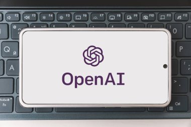 OpenAI logo seen on screen smartphone and laptop. Open AI - American company engaged in the development and licensing of machine learning-based technologies. Barnaul. Russia March 28, 2023. clipart