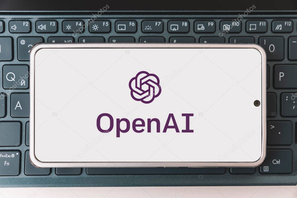 OpenAI logo seen on screen smartphone and laptop. Open AI - American company engaged in the development and licensing of machine learning-based technologies. Barnaul. Russia March 28, 2023.