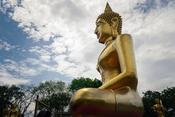 stock image Golden Big Buddha against the background of a blue cloudy sky in Pattaya, Thailand in summer day