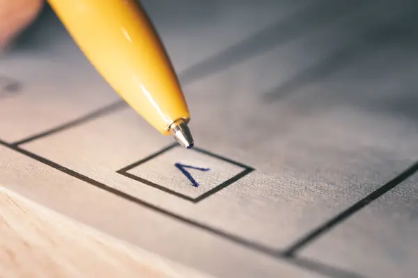 a mark in the selection and a close-up pen. a checkbox for voting. Presidential or parliamentary elections in the country. The concept of choice.