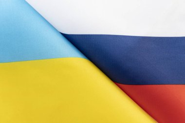 Background of the flags of the ukraine and Russia. The concept of interaction or counteraction between the two countries. International relations. political negotiations. Sports competition. clipart