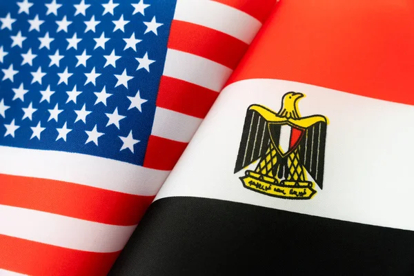 Flags of the USA, Egypt. The concept of international relations between countries. The concept of an alliance or a confrontation between two state governments. Friendship of peoples.