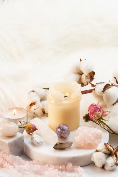 Healing Stones for Crystal Spiritual Ritual, Wicca Practice. Vertical Composition with Esoteric Witchcraft Arrangement with Burning Candles and Gemstones