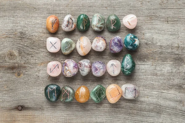 stock image Elder Futhark Rune Stones Set Made of Natural Gemstones on Wooden Background