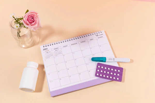 stock image woman menstrual products, calender and pregnancy test