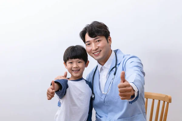 Asian Korean child and doctor doing hand motion