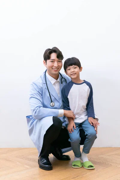 smiling Asian Korean child and a doctor