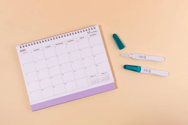 stock image woman menstrual products, calender and pregnancy tests