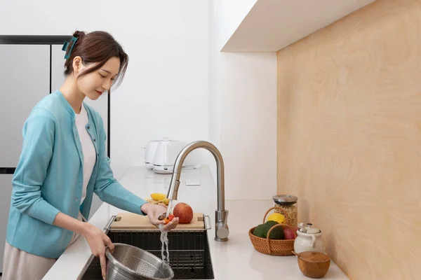 stock image happy single life of korean woman, cooking