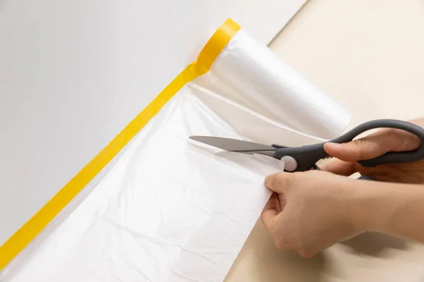 stock image DIY interior hand motion, closeup, putting on covering tape