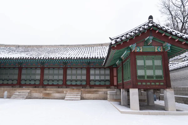 stock image snowing winter scenery of Changdeokgung palace, Korea