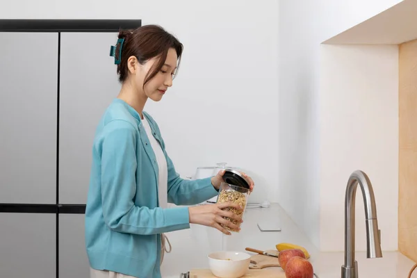 stock image happy single life of korean woman, cooking