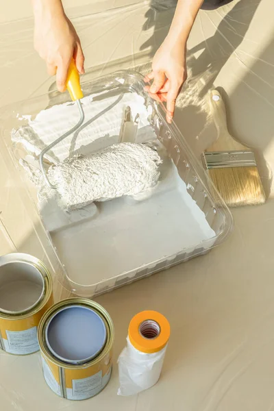 stock image DIY interior hand motion, closeup, holding a paint roller