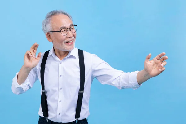 stock image active young senior Korean Asian male dancing