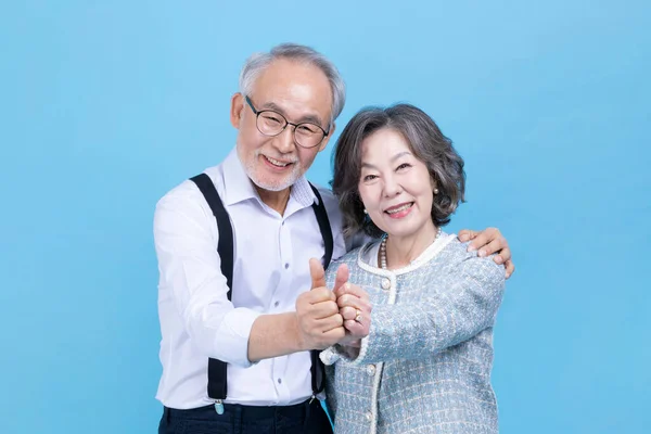 Active Young Senior Korean Asian Couple Hand Motion Studio Background — Stock Photo, Image