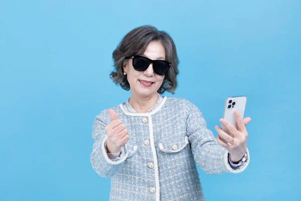 Active Young Senior Korean Asian Woman Sunglasses Using Smartphone — Stock Photo, Image