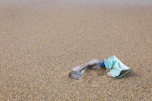 stock image marine litter, ocean plastics and mask close-up view