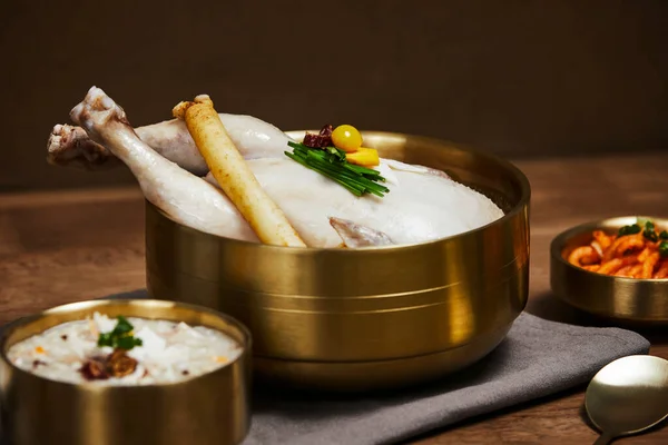 stock image korean traditional food samgyetang and dakjuk, chicken soup with ginseng and chicken rice porridge